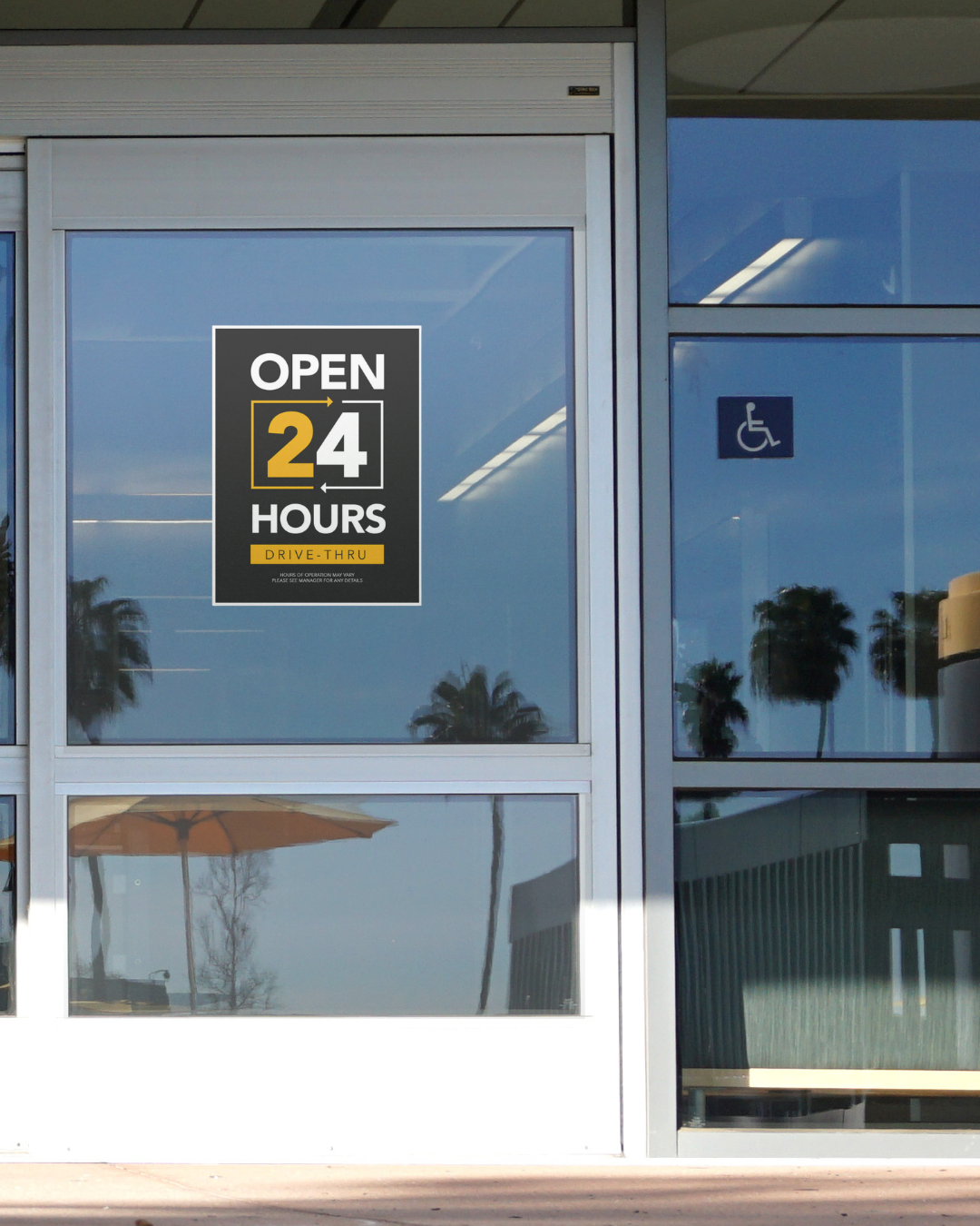 black and yellow 24 hour drive thru decal on automatic door