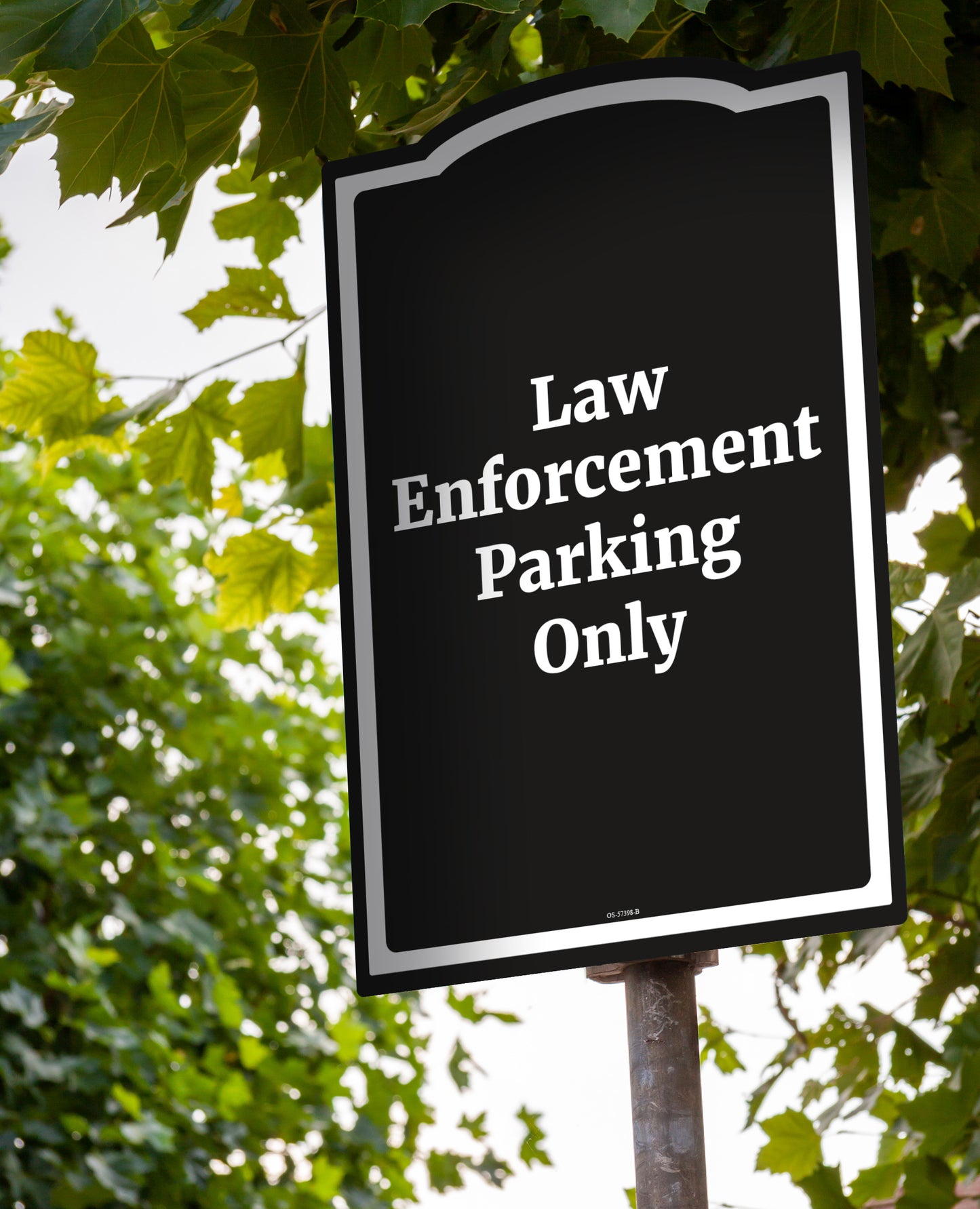 Black sign with white text law enforcement only parking sign