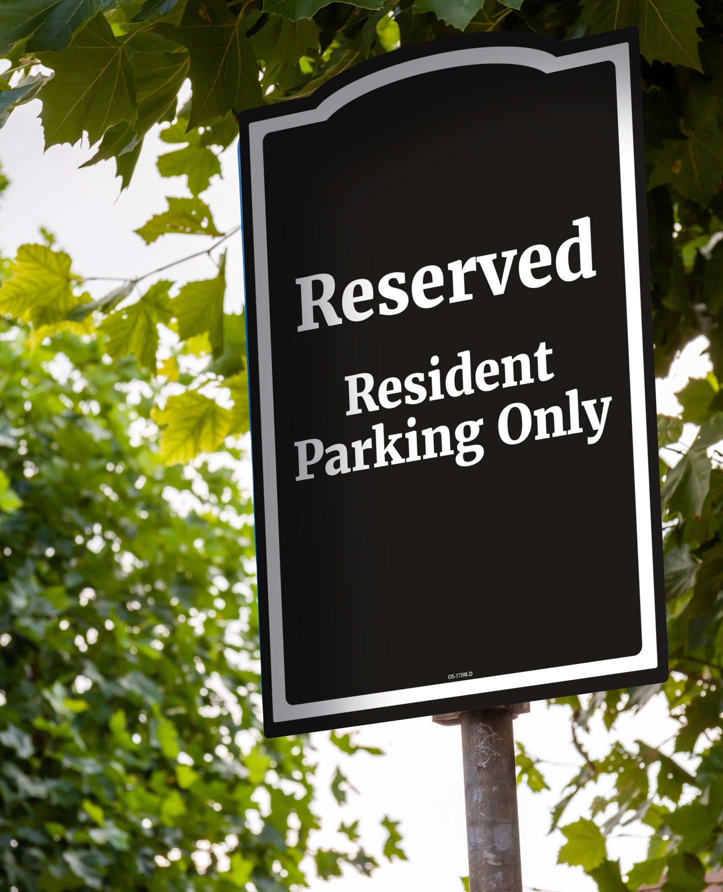 Reserved resident parking only black parking sign white text