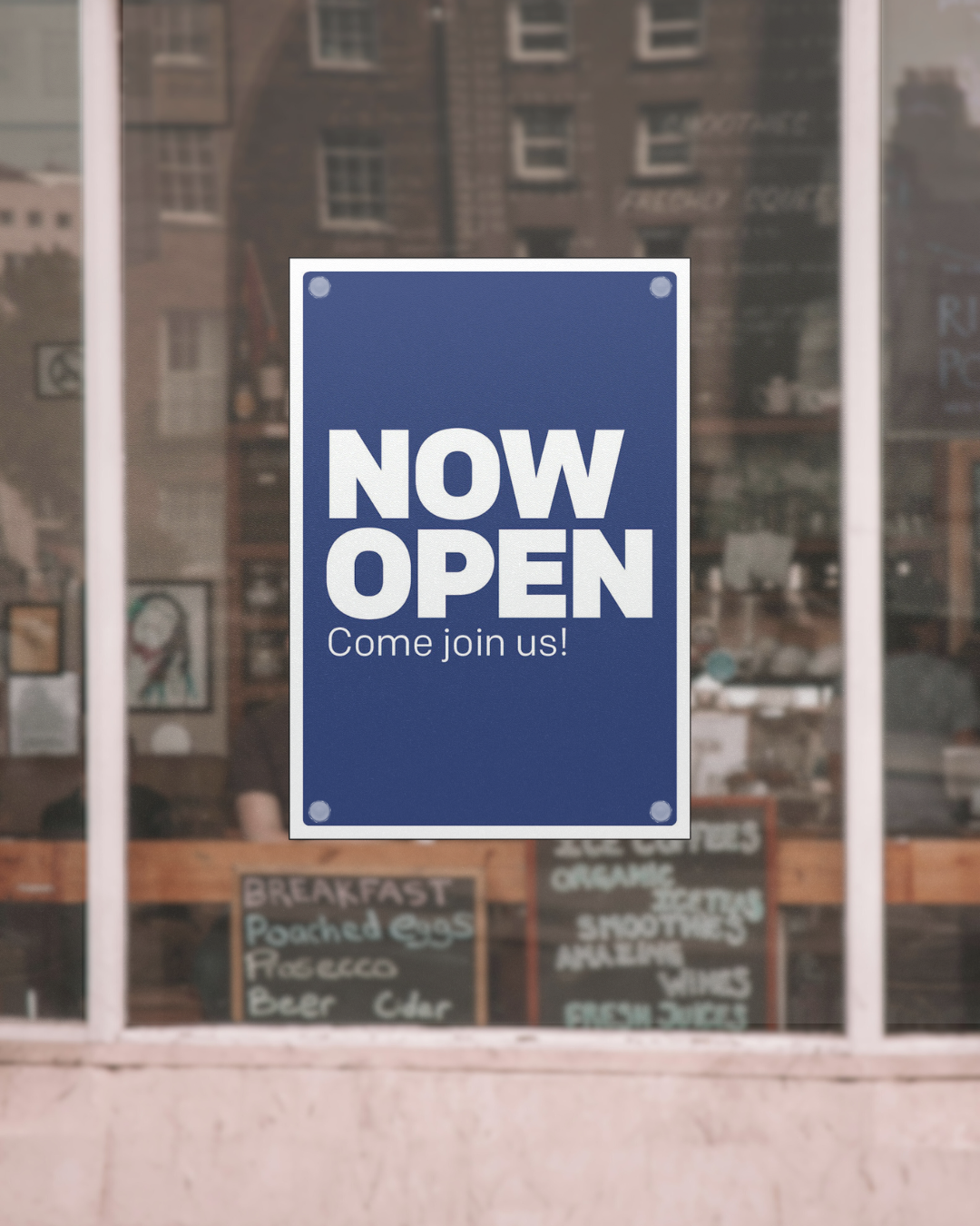 blue now open poster with white letters on a coffee shop window