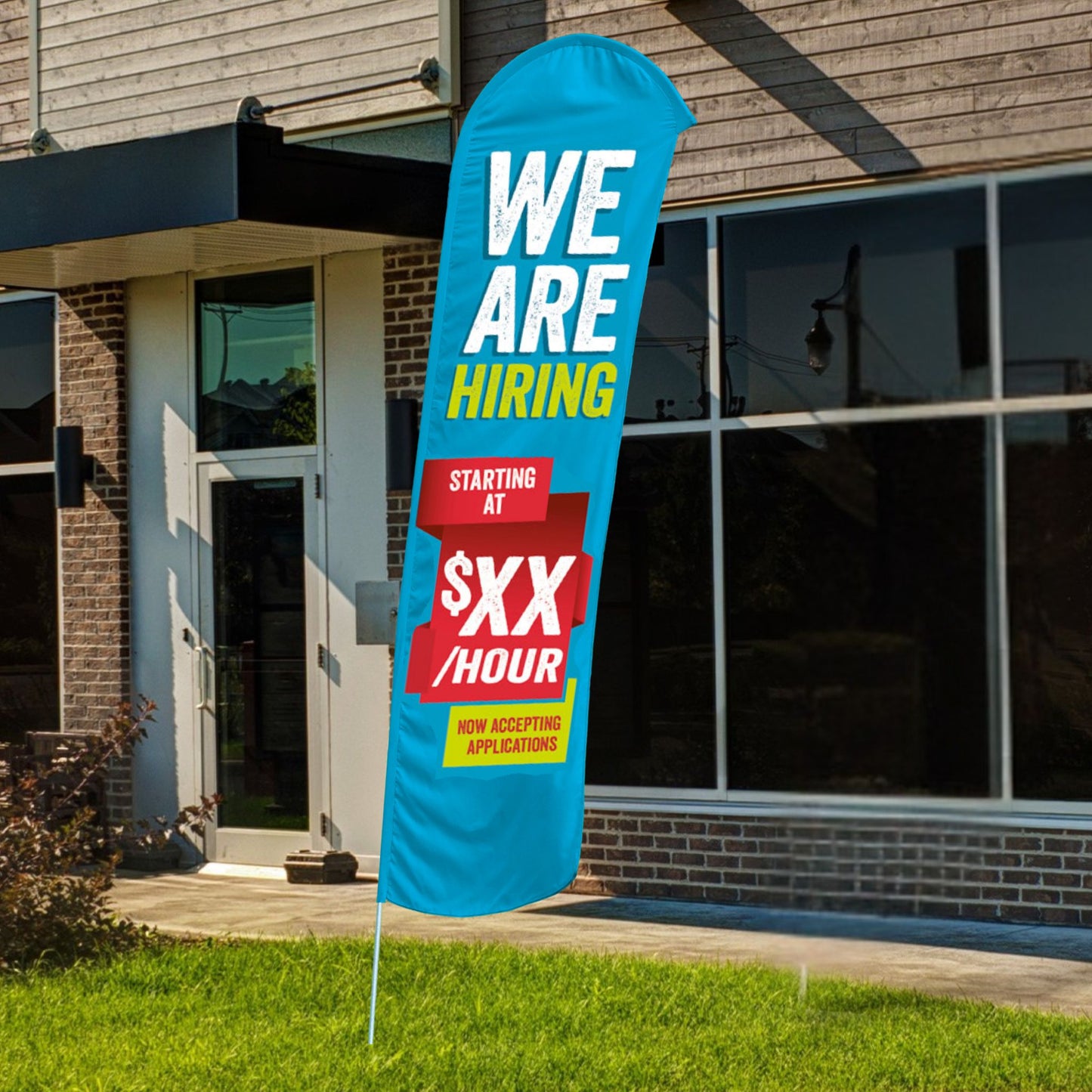 custom we are hiring blue red and yellow blade flag in front of building