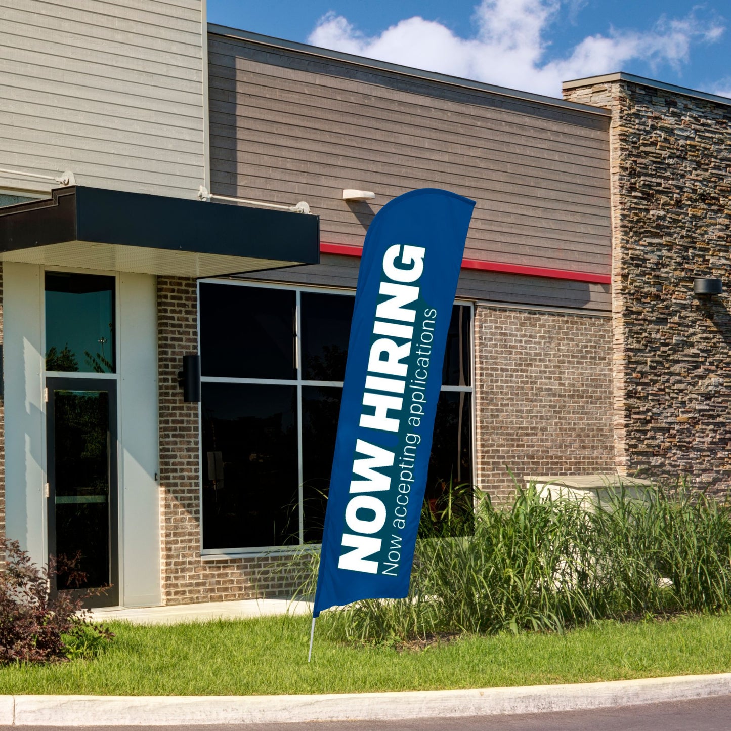 blue and white now hiring blade flag in front of building