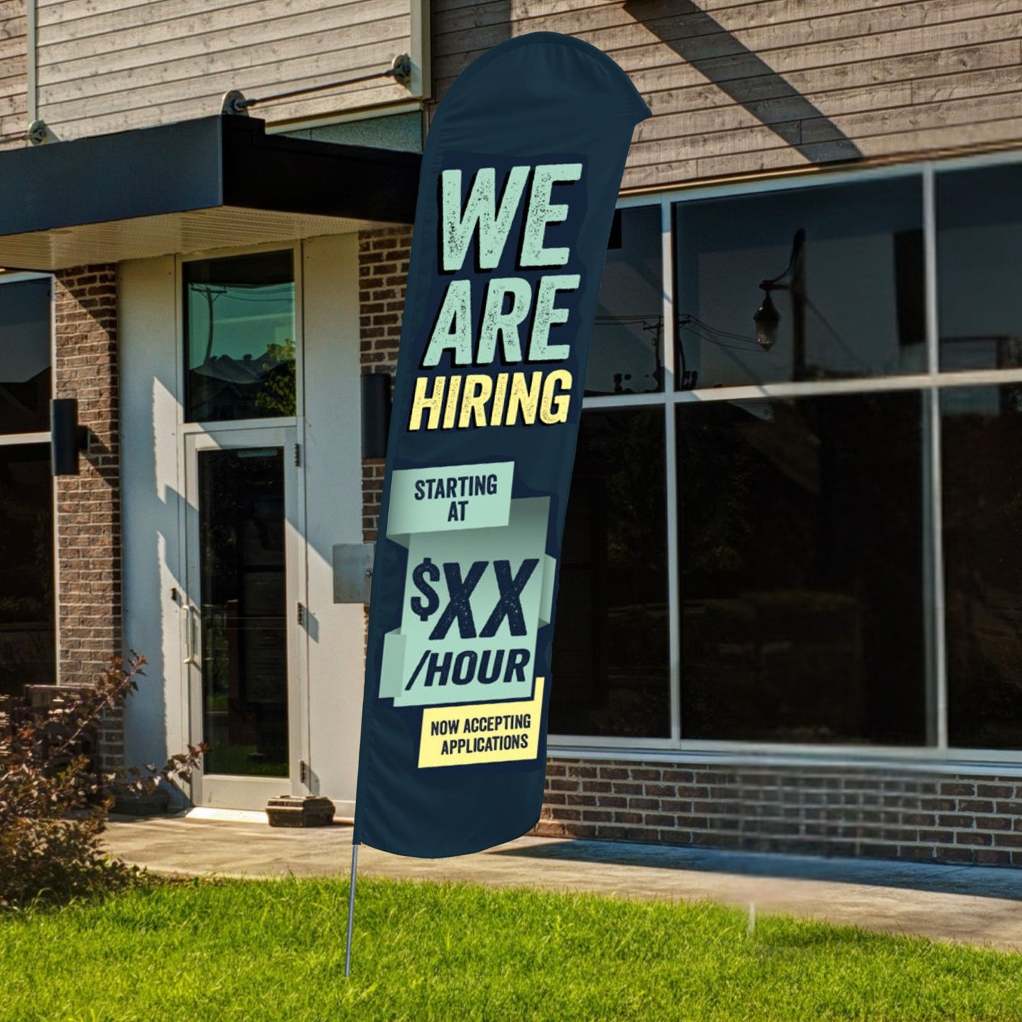 custom navy blue and yellow blade flag in front of building
