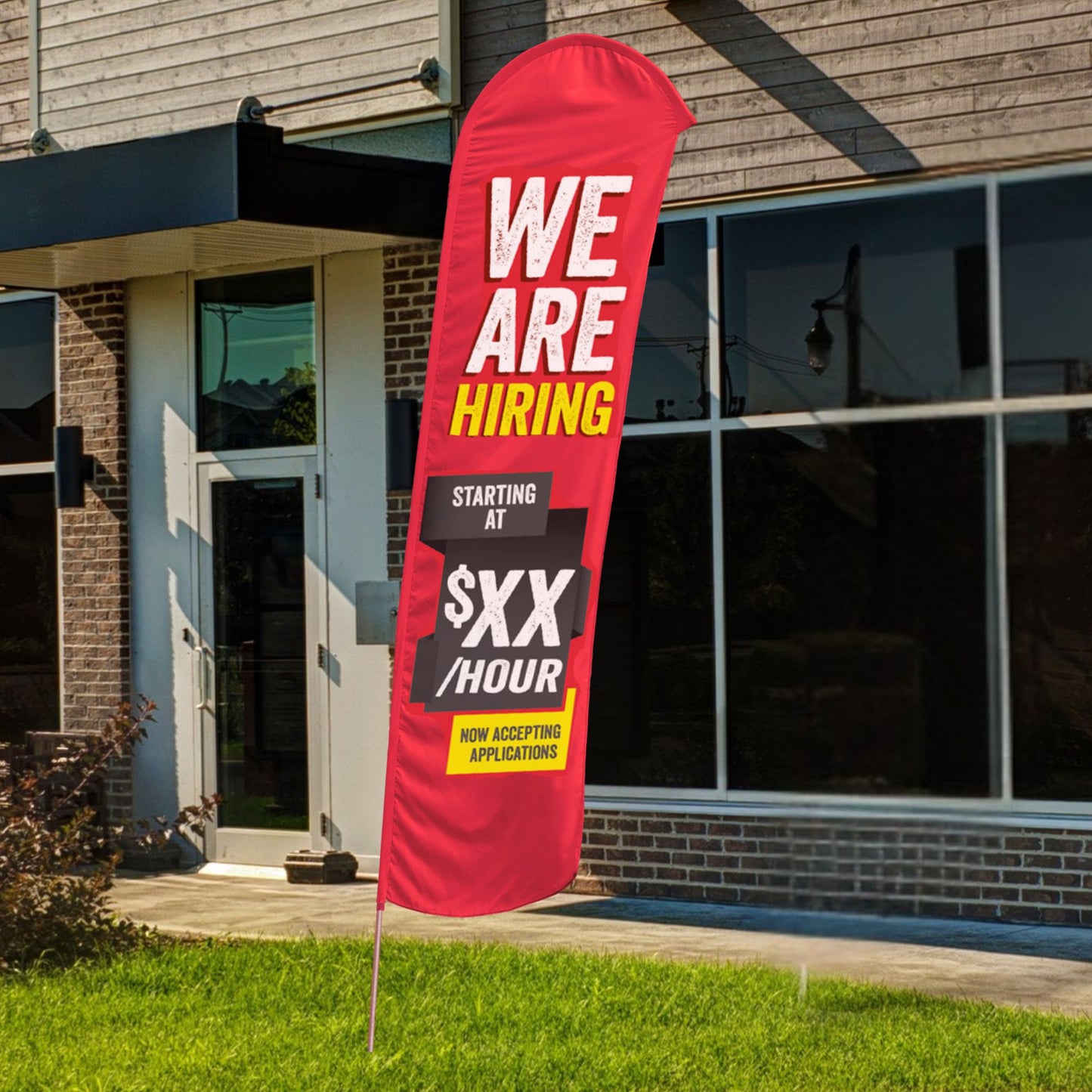 custom we are hiring red and yellow blade flag in front of building