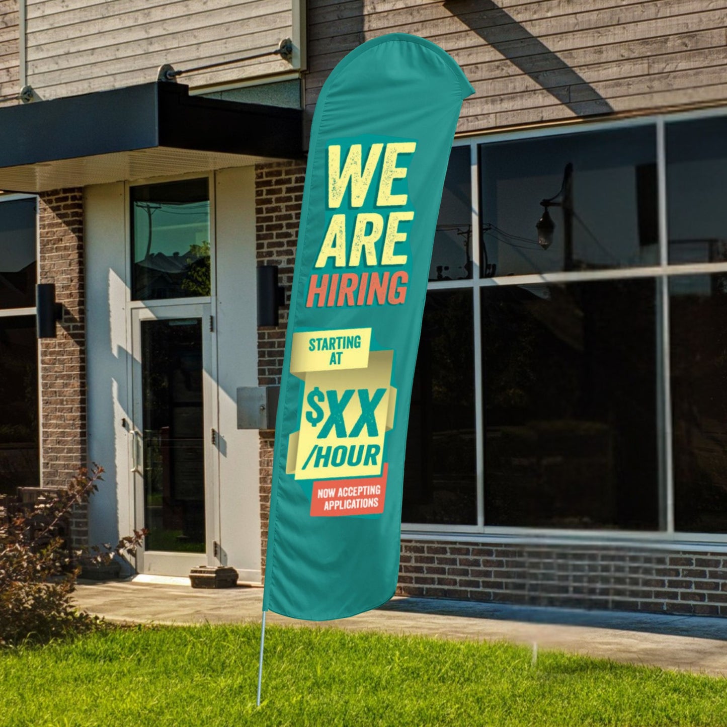 custom teal, orange, and yellow blade flag in front of building