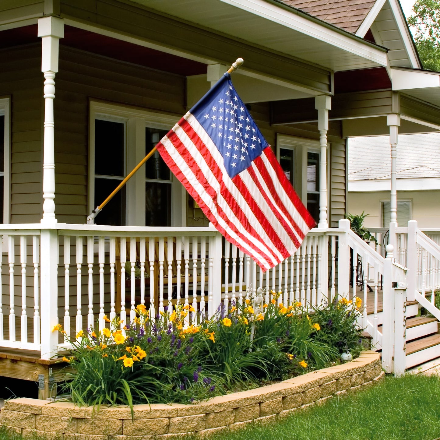 us flag on front of green house