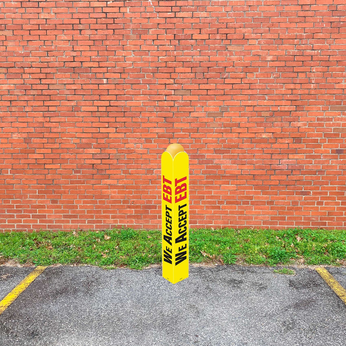 Yellow bollard with sign that says "WE ACCEPT EBT"