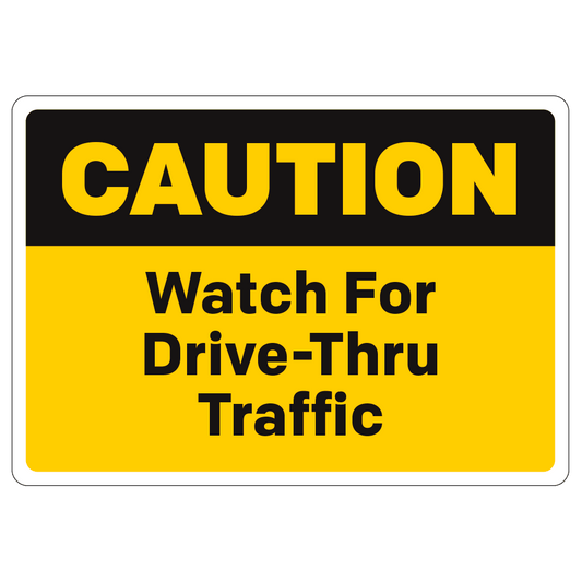 Black and yellow caution watch for drive thru traffic rectangular sign