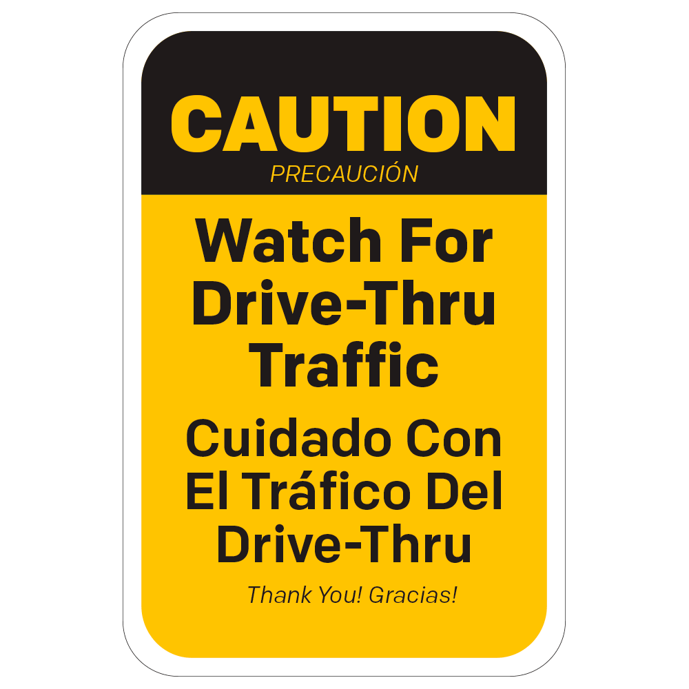Yellow and black bilingual caution watch for drive thru traffic rectangular sign