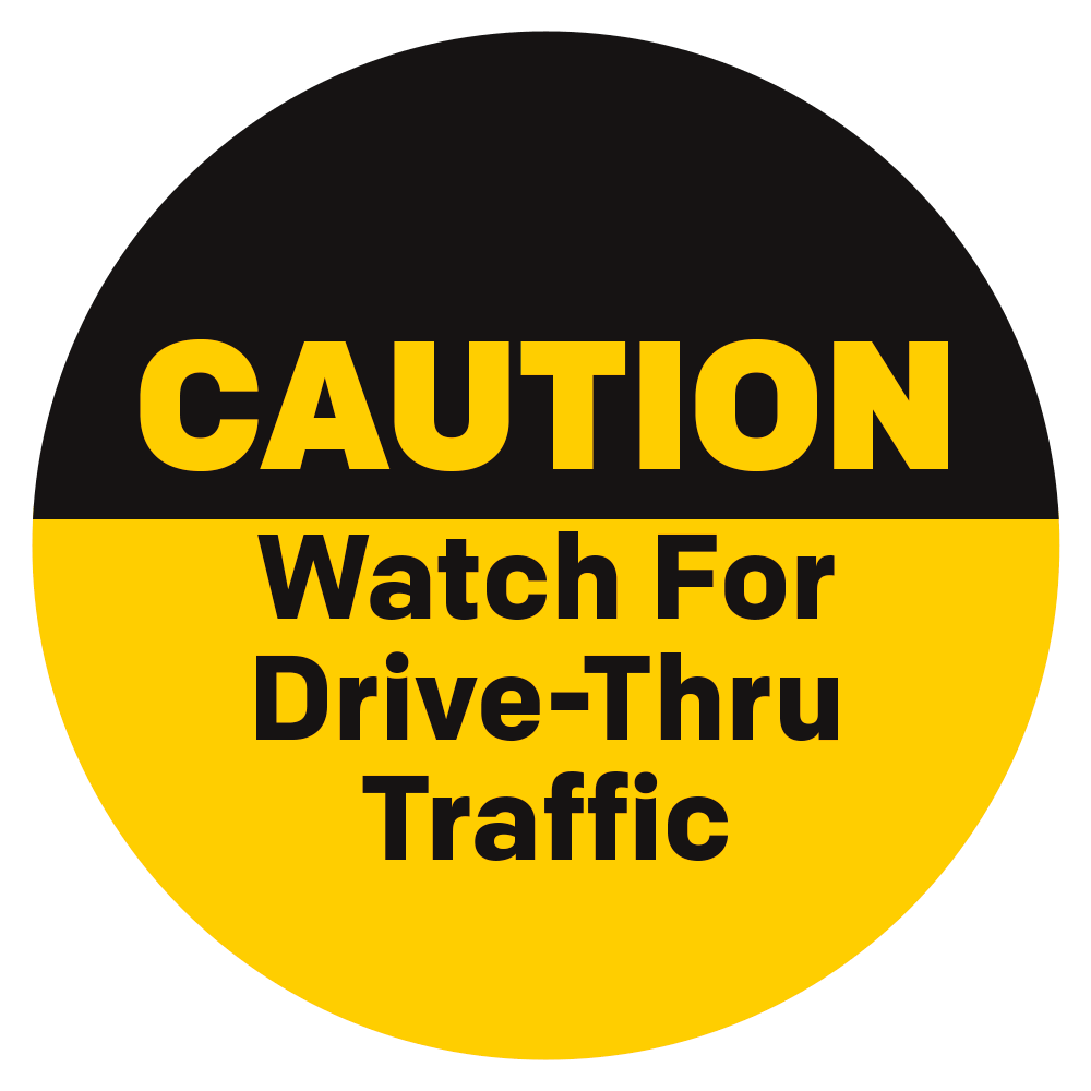 Black and yellow caution watch for drive thru traffic circular sign
