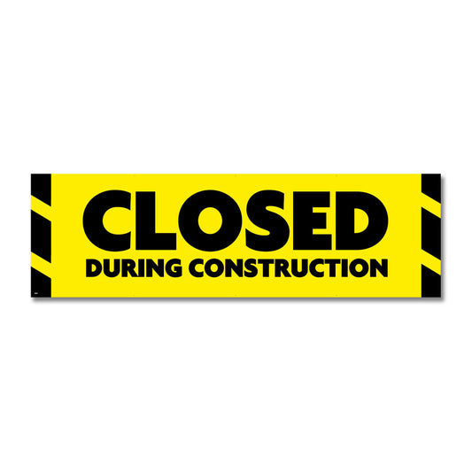 A yellow construction banner with black text stating 'CLOSED DURING CONSTRUCTION' with a black and yellow striped border.