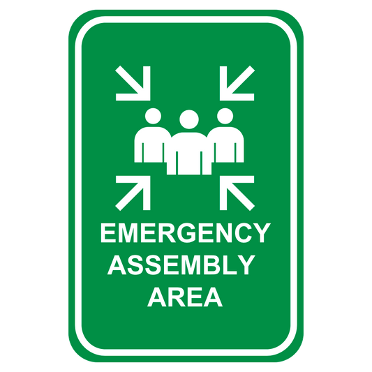 Green sign featuring white arrows pointing to 3 white graphics of people and white letters that say emergency assembly area