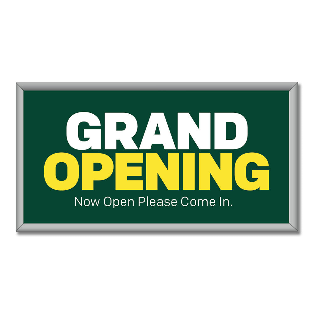 Green mini billboard with white and yellow text 'GRAND OPENING' and additional white text 'Now Open Please Come In.'