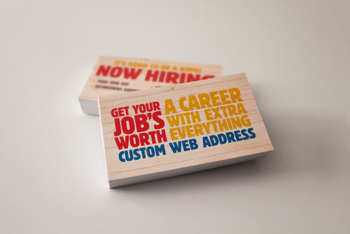 red yellow ad blue now hiring cards on table