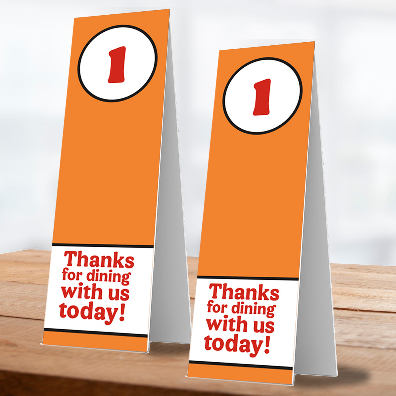 two thanks for dining with us number one table service stand on wooden table