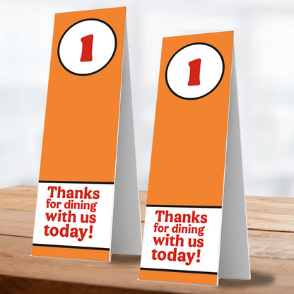 two thanks for dining with us number one table service stand on wooden table