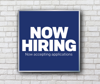 blue now hiring mini billboard on white brick wall