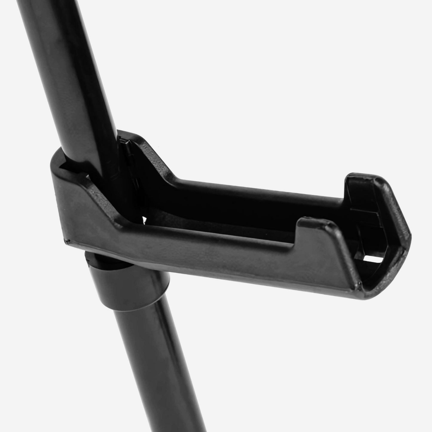 close up perspective of black handle on easle display white background
