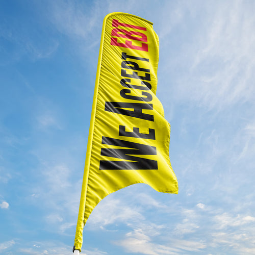 Yellow flag with 'WE ACCEPT EBT' text against a blue sky