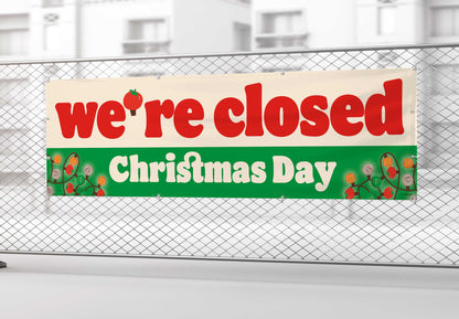 Closed Christmas Day sign on a chain-link fence