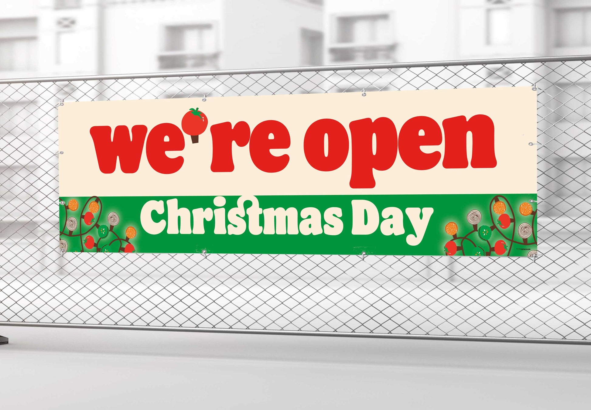 Banner stating 'we're open Christmas Day' on a fence.