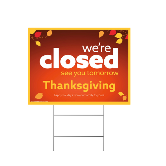 Thanksgiving closed lawn sign with autumn leaves on a white background