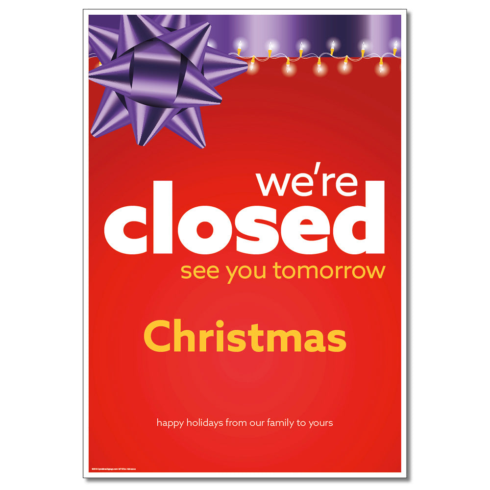 A Christmas-themed sign with the text 'We're Closed Christmas' and a decorative purple gift box graphic.